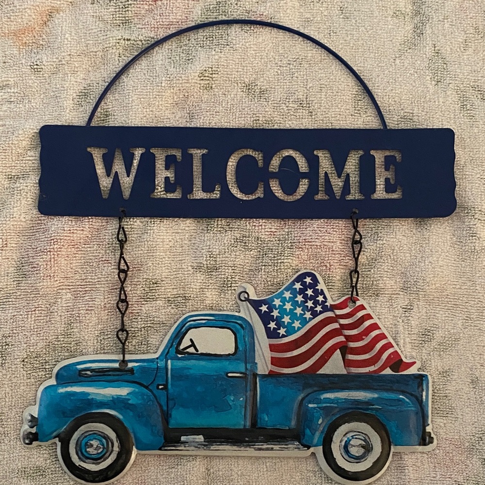 A Classy Chic Boutique Blue Welcome Sign with American Flag